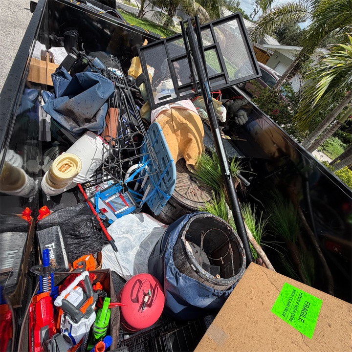 Trailer packed with household junk, toys and boxes