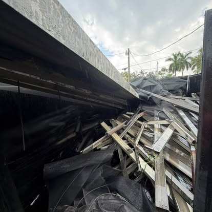 Trailer loaded with lumber and demolition debris